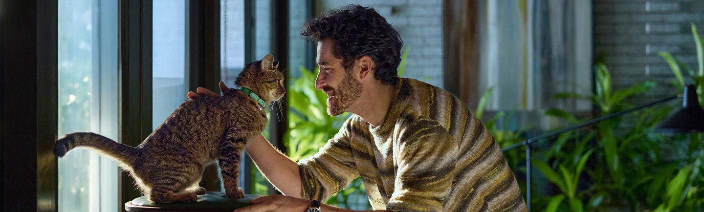 happy-man-and-healthy-cat-sharing-a-close-moment.